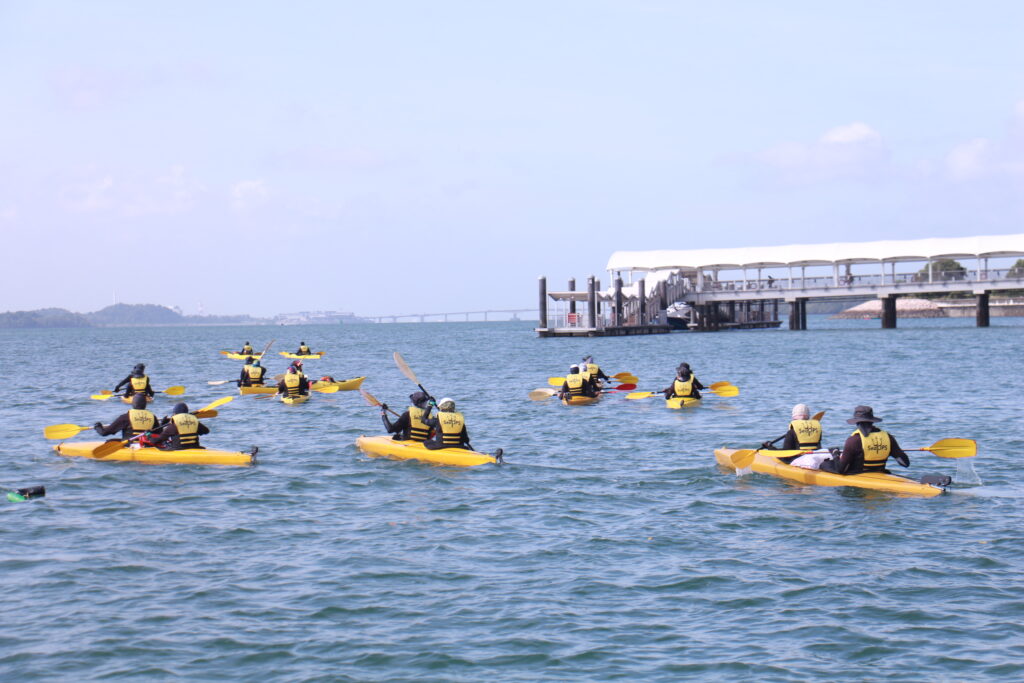 Team kayaking together in a thrilling outdoor adventure